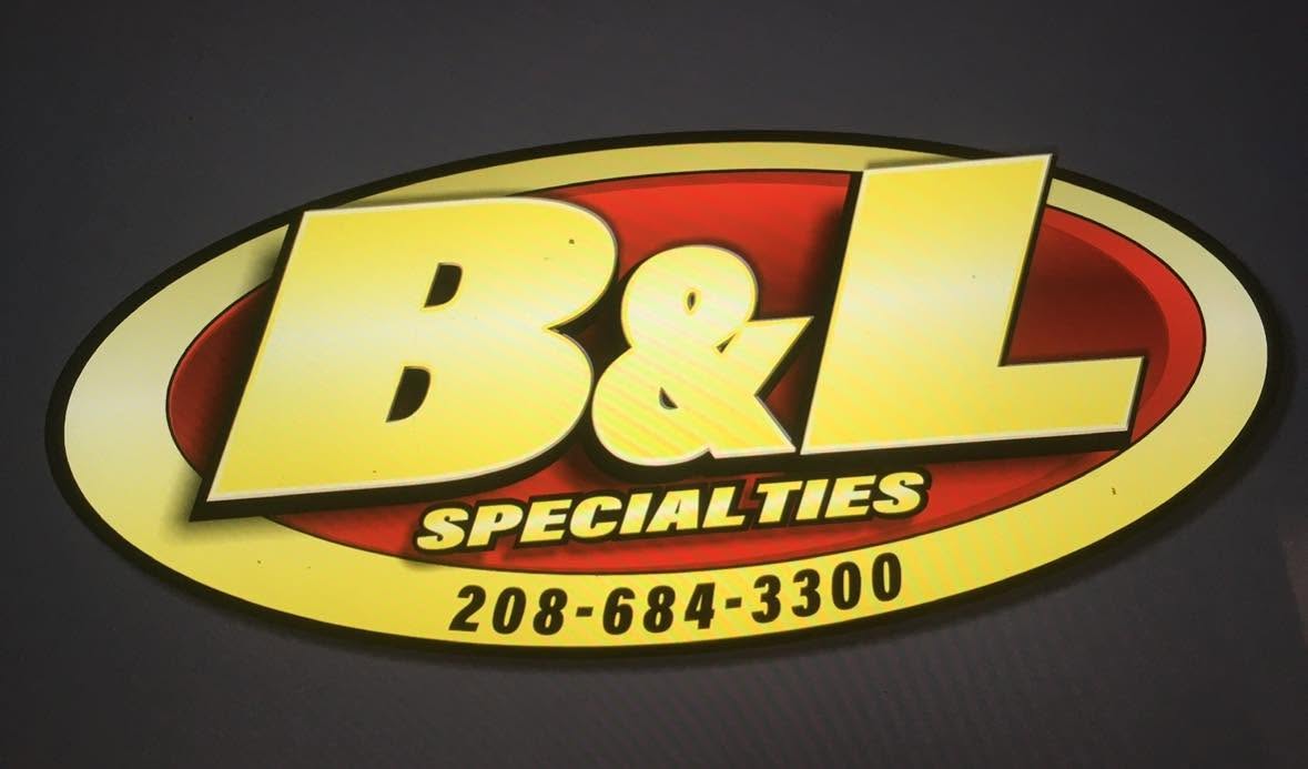 The yellow and red B&L Specialties oval sign with the phone number 208-684-3300.